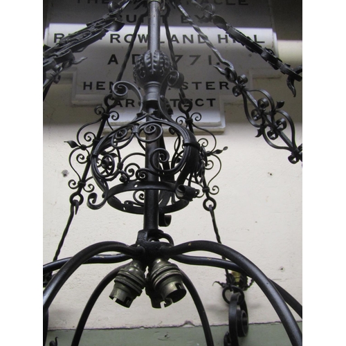 2122 - A good quality ironwork hanging ceiling light with decorative open scrollwork, flower head, leaf and... 