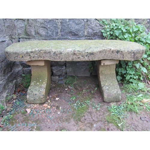 2065 - A good weathered imitation stone crescent shaped bench, 113cm wide x 38cm deep x 46cm high