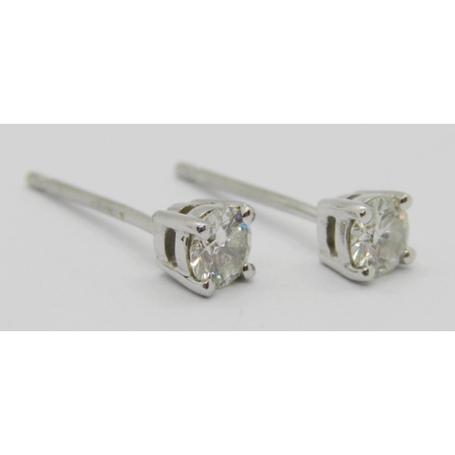 1359 - Pair of 950 platinum diamond stud earrings, 0.15ct each approx, maker 'UT', 1.1g