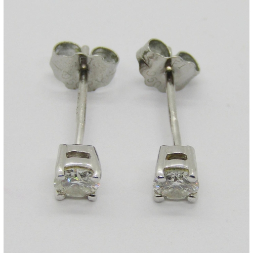 1359 - Pair of 950 platinum diamond stud earrings, 0.15ct each approx, maker 'UT', 1.1g