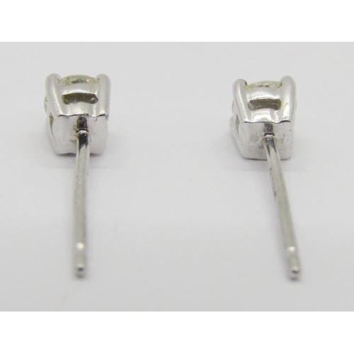 1359 - Pair of 950 platinum diamond stud earrings, 0.15ct each approx, maker 'UT', 1.1g