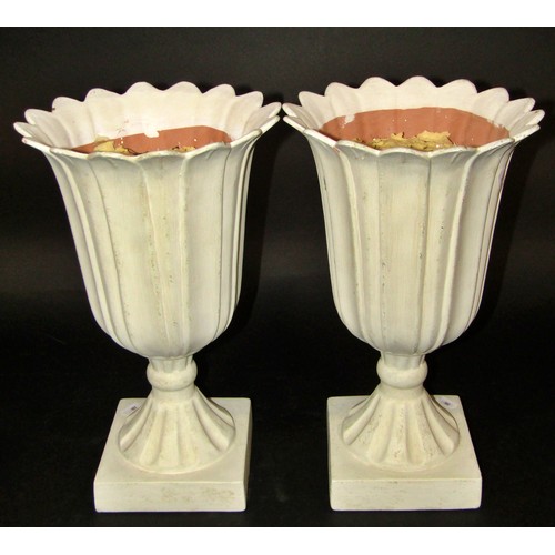 1073 - A classical marbled statue in resin and two flared vases