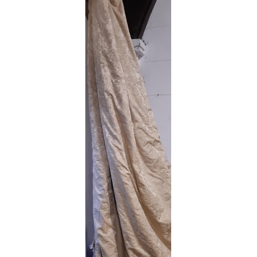 401 - One pair of very large heavyweight curtains in pale gold damask with pencil pleat heading, lined and... 