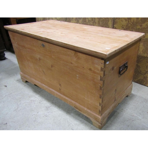 2205 - 19th century stripped pine coffer with hinged lid, drop side carrying handles and exposed dovetail c... 