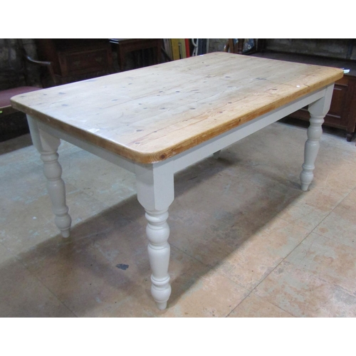 2209 - A Victorian style pine kitchen table, the stripped rectangular top with rounded corners, raised on p... 