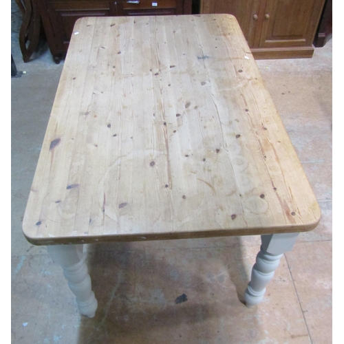 2209 - A Victorian style pine kitchen table, the stripped rectangular top with rounded corners, raised on p... 