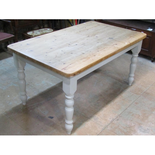 2209 - A Victorian style pine kitchen table, the stripped rectangular top with rounded corners, raised on p... 