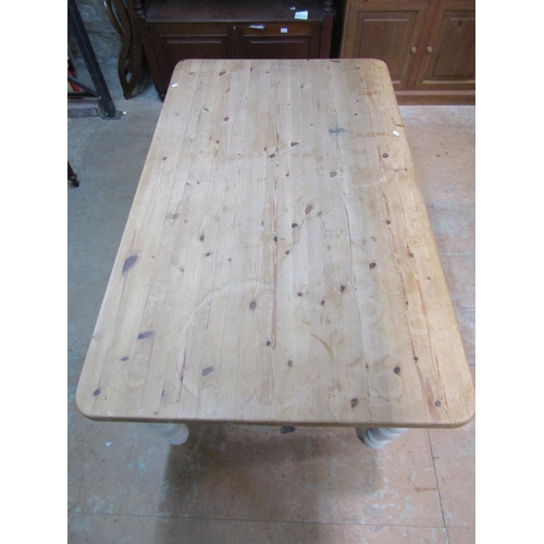 2209 - A Victorian style pine kitchen table, the stripped rectangular top with rounded corners, raised on p... 