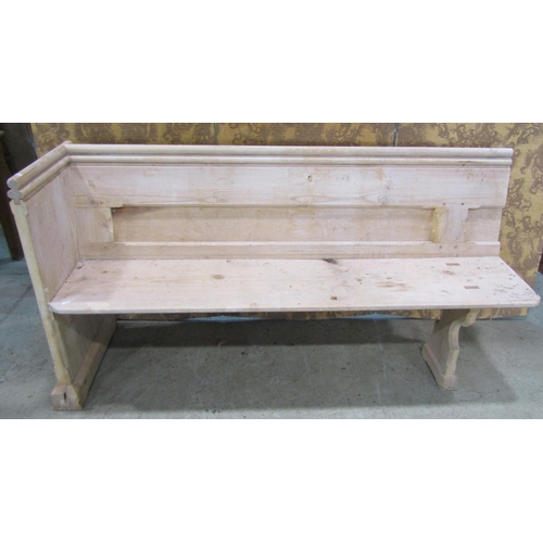 2212 - A stripped pine church pew, with moulded and chamfered frame and single shaped end, 62cm long