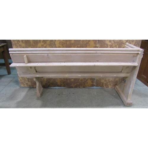 2212 - A stripped pine church pew, with moulded and chamfered frame and single shaped end, 62cm long