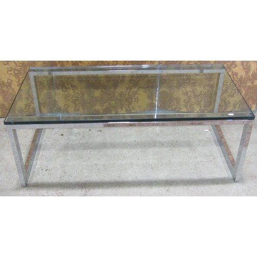 2221 - A modernist low occasional table of rectangular form, raised on chrome supports with tempered glass ... 