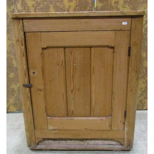 2225 - A rustic stripped pine side cupboard enclosed  by a chamfered tongue and groove panelled door within... 