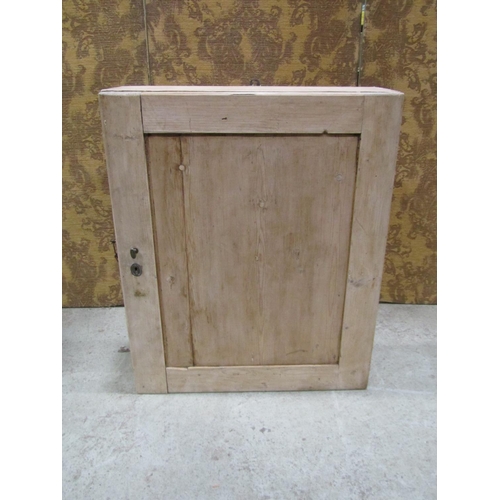 2230 - Old stripped pine hanging cupboard with rectangular panelled door enclosing a painted fixed shelf to... 