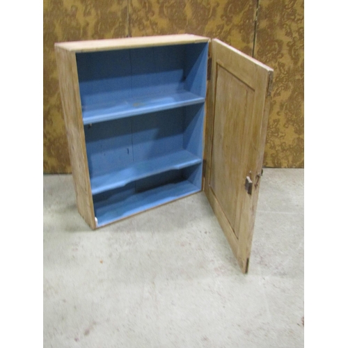 2230 - Old stripped pine hanging cupboard with rectangular panelled door enclosing a painted fixed shelf to... 