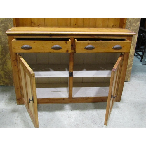 2236 - Rustic stripped pine kitchen dresser, the base enclosed by a pair of twin panelled doors beneath two... 