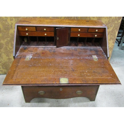 2239 - Georgian oak bureau the fall flap enclosing a partially fitted interior with mahogany fronted drawer... 