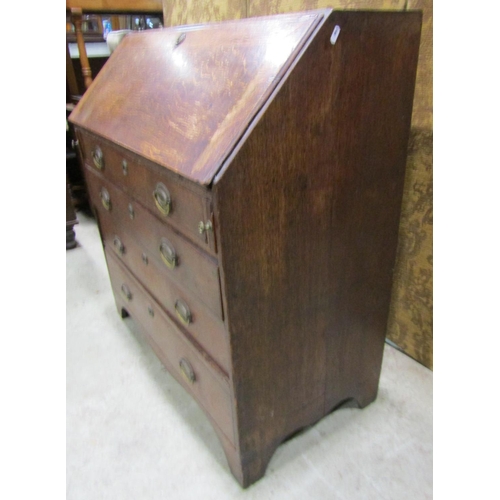 2239 - Georgian oak bureau the fall flap enclosing a partially fitted interior with mahogany fronted drawer... 