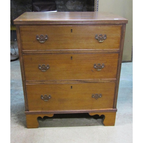 2241 - A small Georgian style mahogany chest of three long graduated drawers set on bracket feet, 68cm wide... 