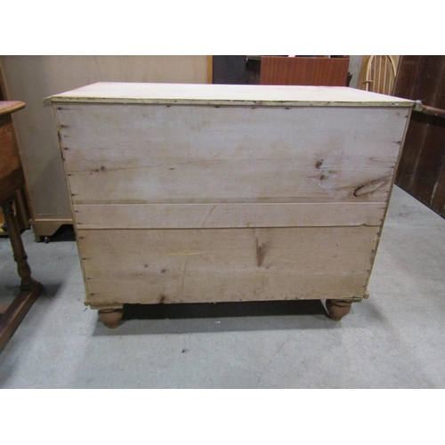 2242 - A Victorian stripped pine chest of two long and two short drawers set on turned feet, 95cm wide x 51... 