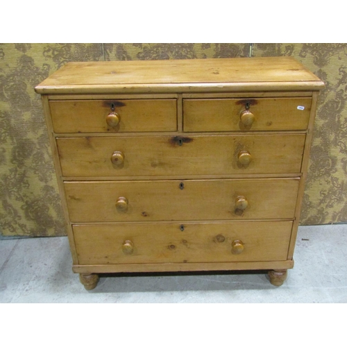 2243 - A stripped and waxed pine chest of three long and two short drawers, raised on turned supports, 105c... 