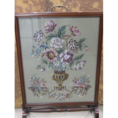 2247 - A late 19th century mahogany framed firescreen with hand worked tapestry panel raised on shaped supp... 