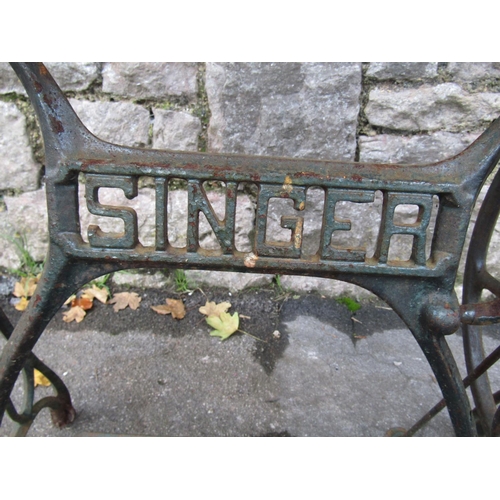 2052 - Vintage cast iron Singer sewing machine base, later adapted as a garden table or wash stand with rem... 