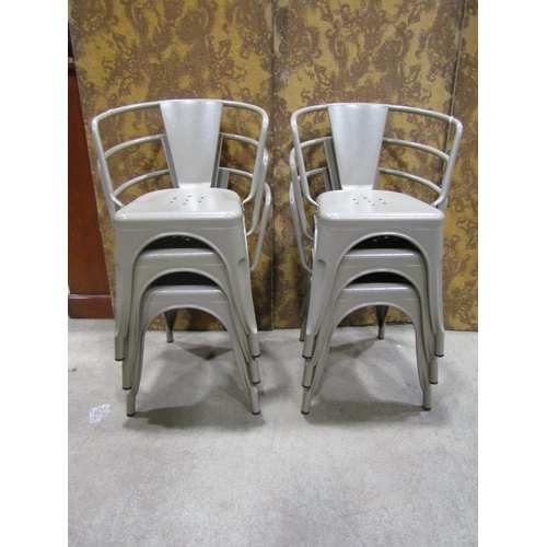 2169 - A set of six vintage style sage green painted tubular stacking aluminium chairs with pierced seats