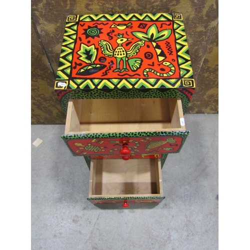 2215 - A small wooden painted four drawer chest with all over brightly painted decoration, 40cm wide x 33cm... 