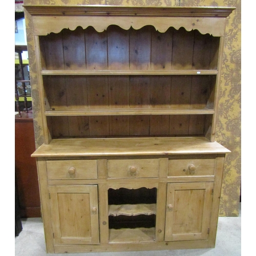 2250 - A reclaimed stripped pine kitchen dresser the base enclosed by an arrangement of cupboards and doors... 