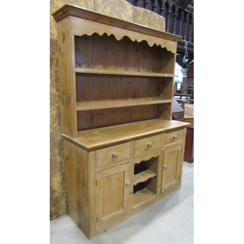 2250 - A reclaimed stripped pine kitchen dresser the base enclosed by an arrangement of cupboards and doors... 