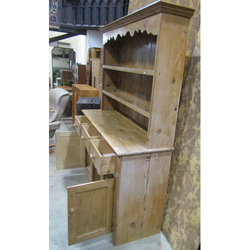 2250 - A reclaimed stripped pine kitchen dresser the base enclosed by an arrangement of cupboards and doors... 