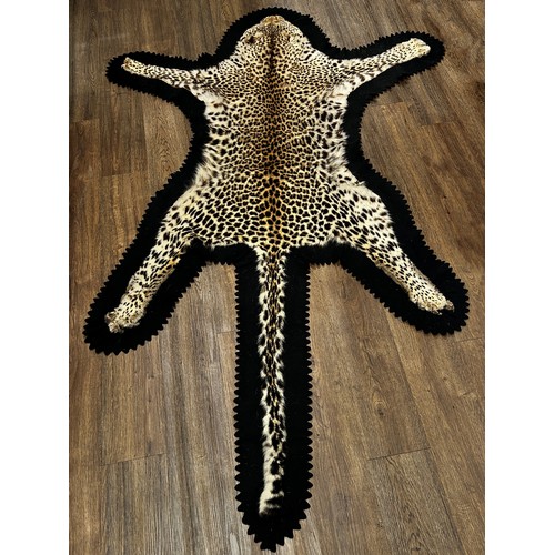 2727 - A Rowland Ward Leopard Skin on a black felt lining 178cm x 120cm approximately.