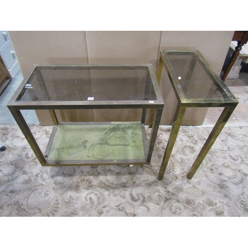 2203 - A vintage two tier brass framed glass, topped occasional table, the base decorated with a map of New... 