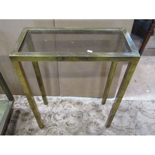 2203 - A vintage two tier brass framed glass, topped occasional table, the base decorated with a map of New... 