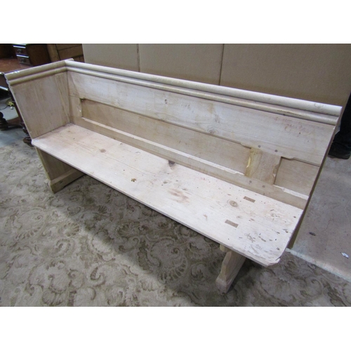 2212 - A stripped pine church pew, with moulded and chamfered frame and single shaped end, 62cm long