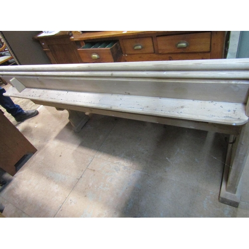 2212 - A stripped pine church pew, with moulded and chamfered frame and single shaped end, 62cm long