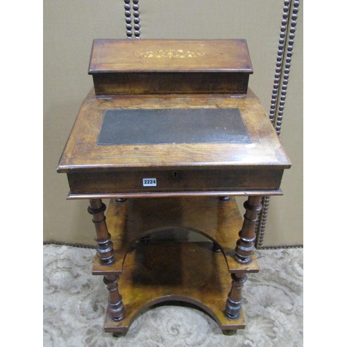 2224 - A Victorian walnut three tier writing desk with inlaid detail raised stationery compartment over a s... 