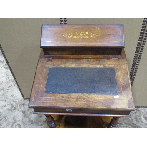 2224 - A Victorian walnut three tier writing desk with inlaid detail raised stationery compartment over a s... 