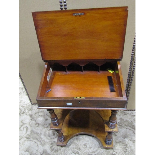 2224 - A Victorian walnut three tier writing desk with inlaid detail raised stationery compartment over a s... 