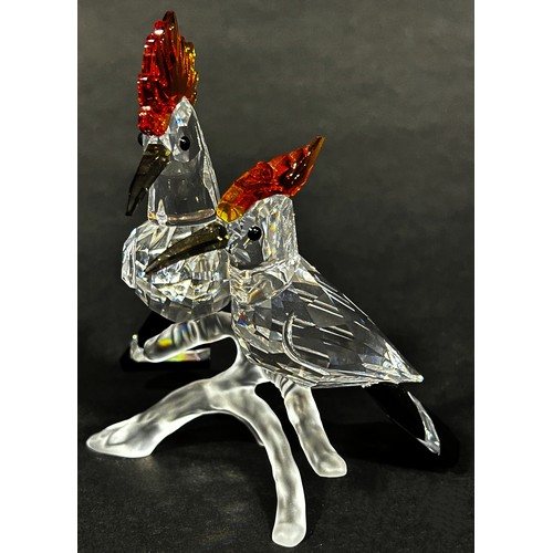 1114 - A pair of Swarovski crystal tropic bird figures, to include a toucan and hoopoes