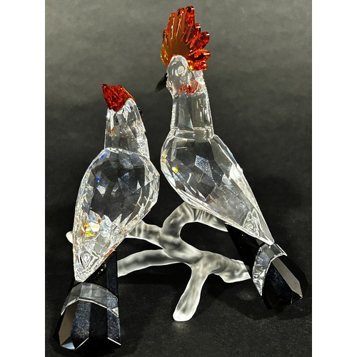 1114 - A pair of Swarovski crystal tropic bird figures, to include a toucan and hoopoes