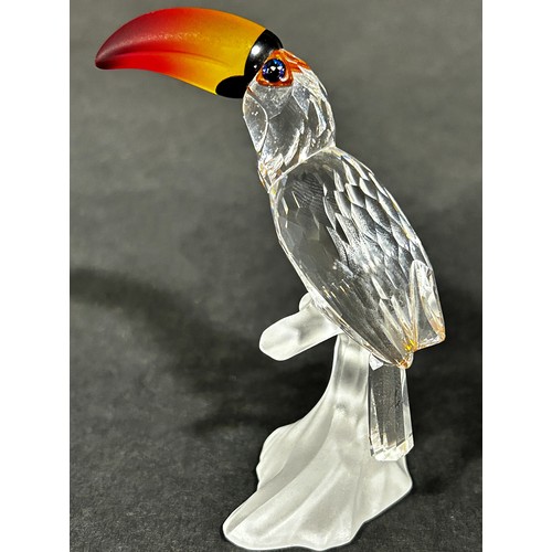 1114 - A pair of Swarovski crystal tropic bird figures, to include a toucan and hoopoes