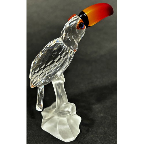 1114 - A pair of Swarovski crystal tropic bird figures, to include a toucan and hoopoes