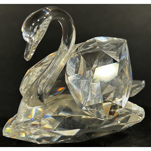 1117 - A small group of Swarovski crystal figures including a dragonfly, swan and a squirrel holding a diam... 