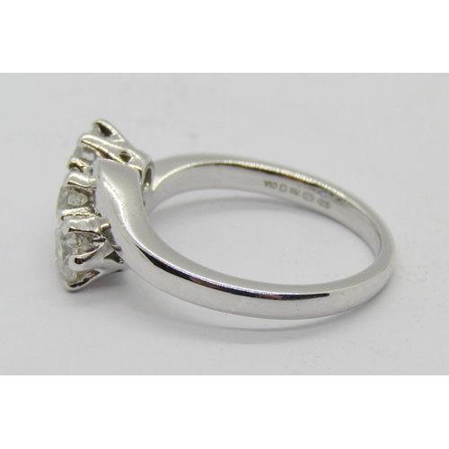 1363 - 18ct white gold three stone diamond crossover ring, each stone 0.20ct approx, maker 'RG', size J/K, ... 