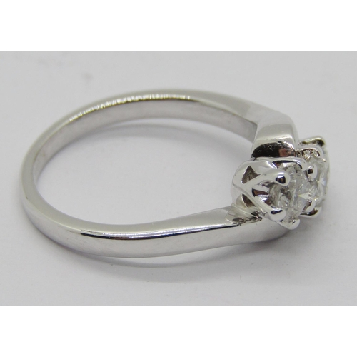 1363 - 18ct white gold three stone diamond crossover ring, each stone 0.20ct approx, maker 'RG', size J/K, ... 