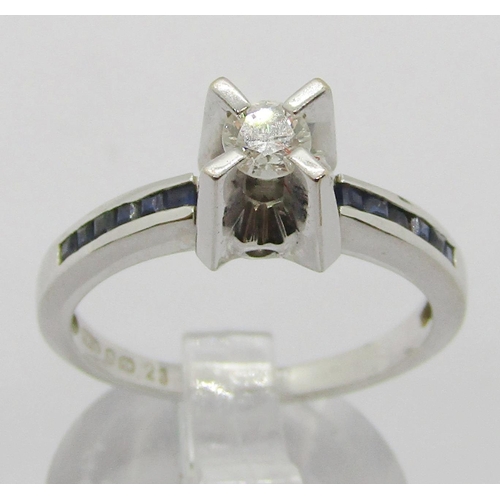 1365 - 18ct white gold diamond and channel set sapphire ring with raised setting, the diamond 0.20ct approx... 