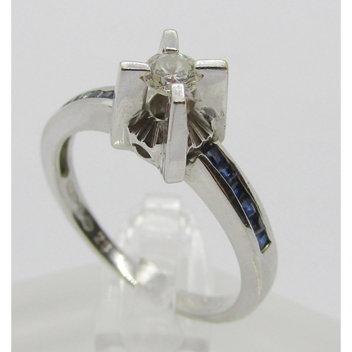 1365 - 18ct white gold diamond and channel set sapphire ring with raised setting, the diamond 0.20ct approx... 