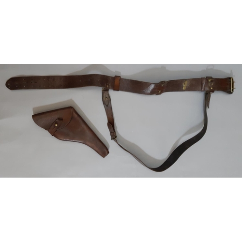 1778 - A First World War period brown leather belt and side arm / revolver holster.