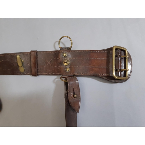 1778 - A First World War period brown leather belt and side arm / revolver holster.